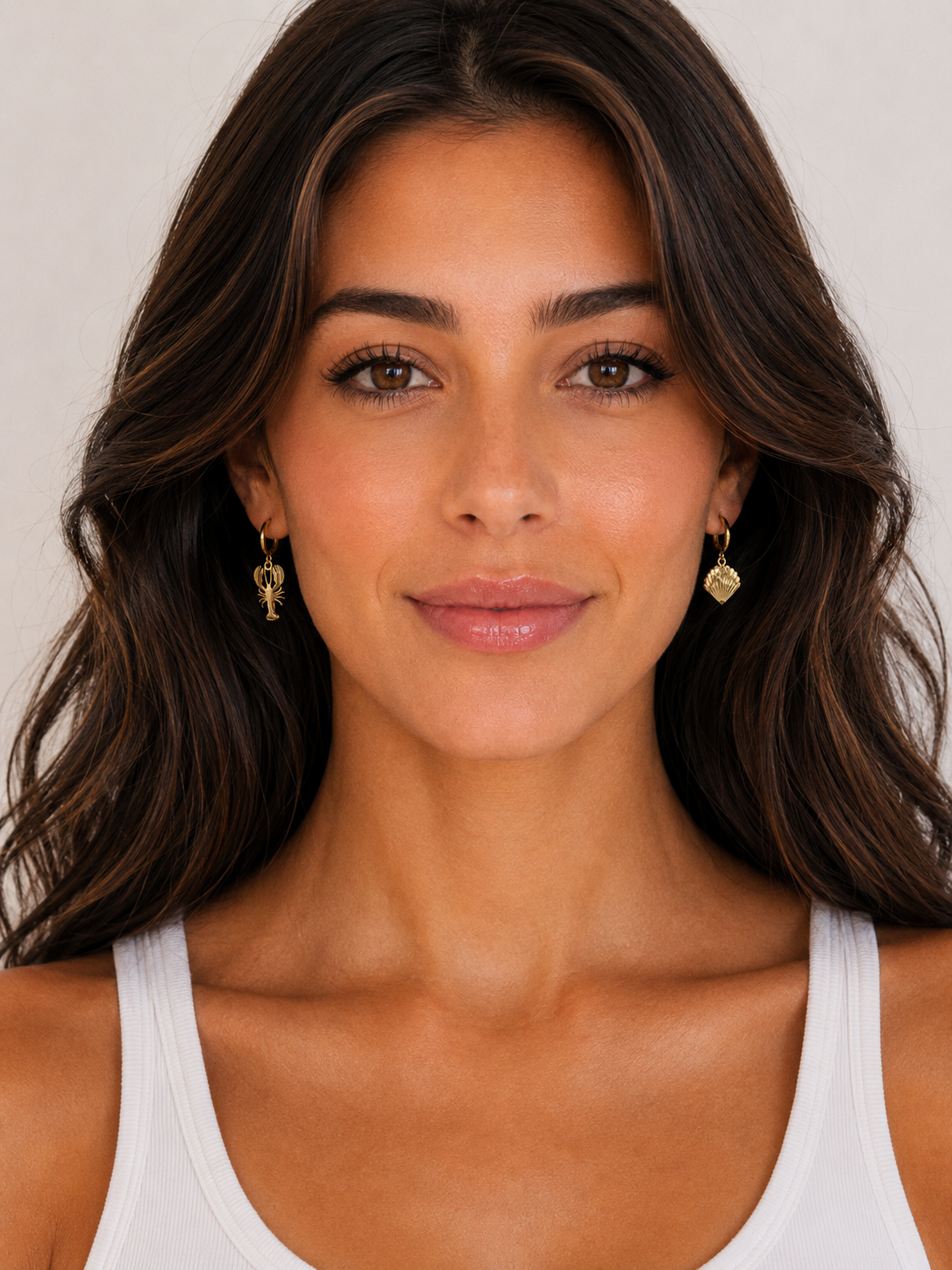 Beach themed huggie hoop earrings in gold, lobster and shell design