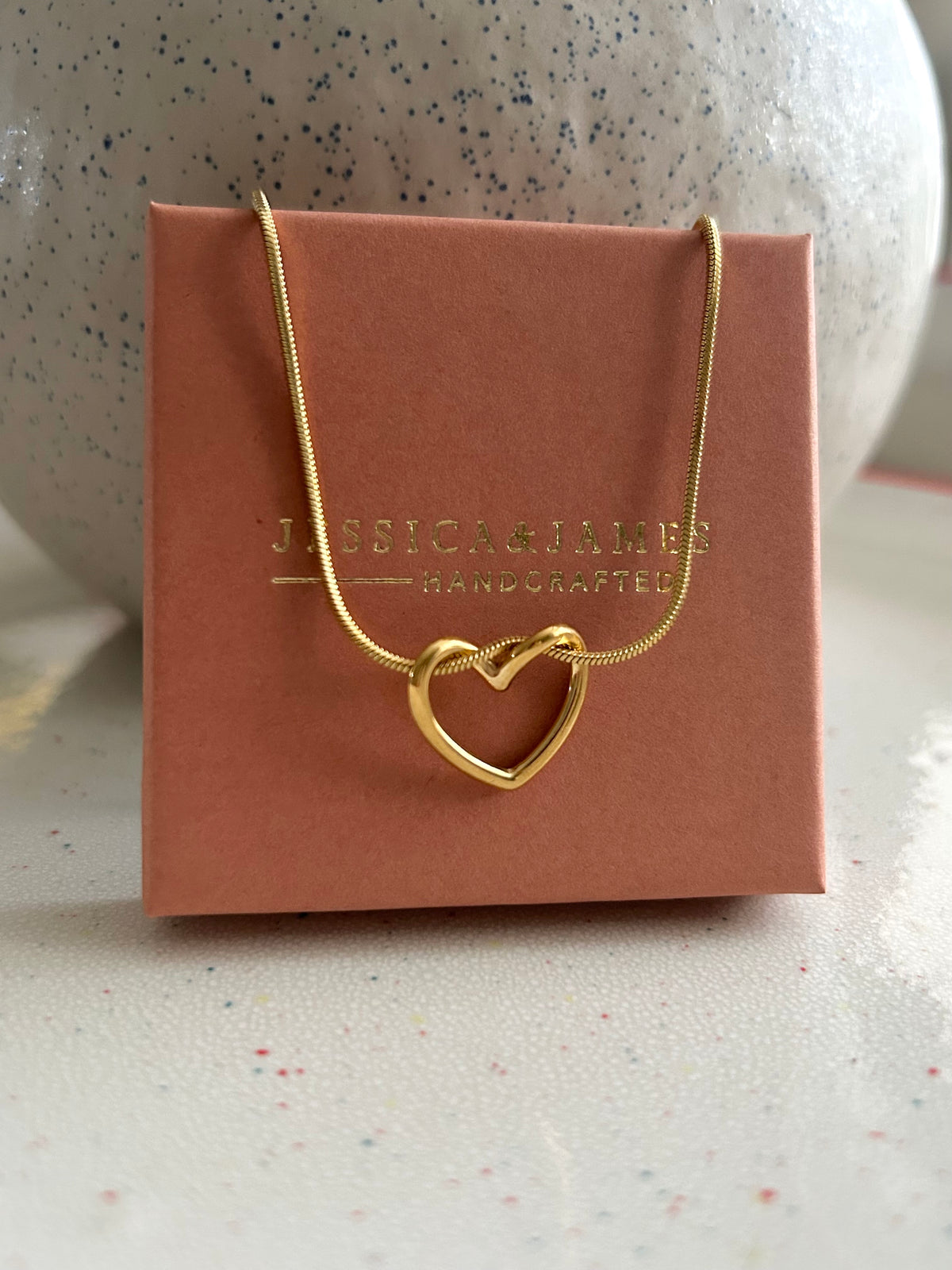 Floating love entwined heart necklace