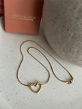 Floating love entwined heart necklace